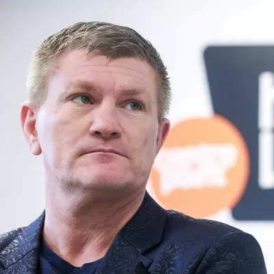 Ricky Hatton stands in front of the Centrepoint Helpline logo