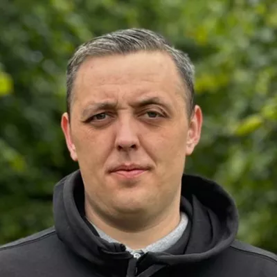 Close up of man facing the camera standing in a park