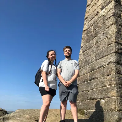 Young couple outside looking into the camera