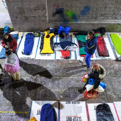 people set up their sleeping spaces