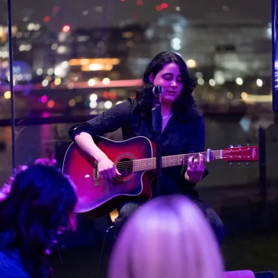 Rana, a Centrepoint young person, performs at the OXO Tower at the Ultimate Quiz 2025