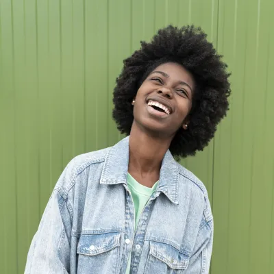 Young woman smiling and looking up
