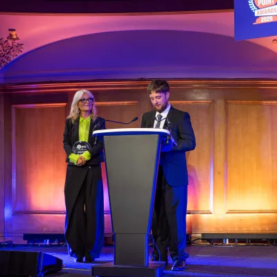 Gaby Roslin and young person winning an award