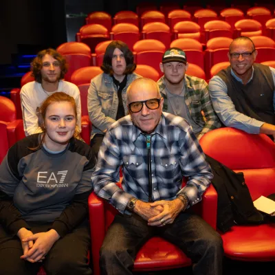 Daniel Day Lewis and Centrepoint young people in a movie theatre