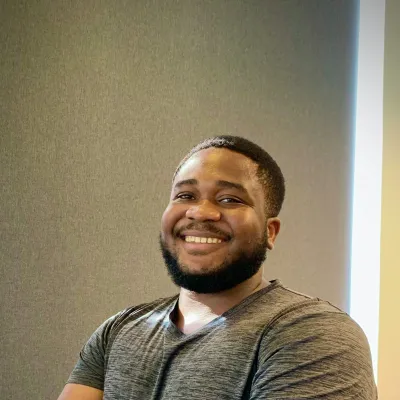 Man smiling with cross arms