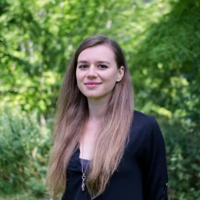 Young woman looking at camera and smiling