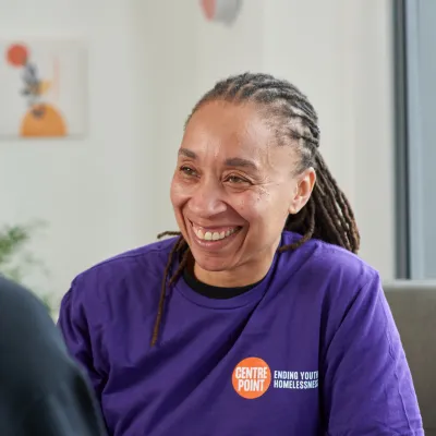 A Centrepoint member of staff offers support to a young person experiencing homelessness