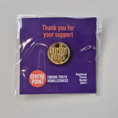 Centrepoint pin badge in a gold colour