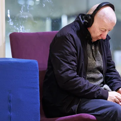 Sleep Out participant listening to headphones